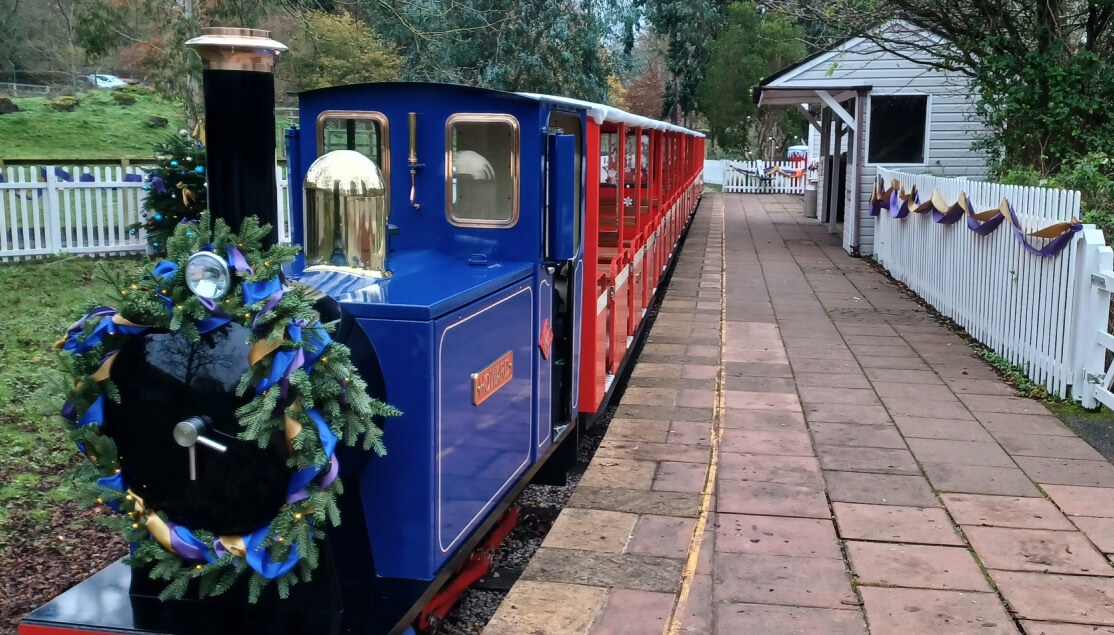 Miniature train with Christmas wreath